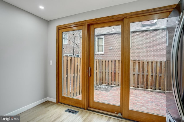 doorway featuring light hardwood / wood-style flooring