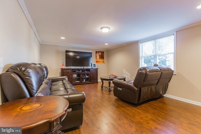 living room with dark wood-type flooring and ornamental molding