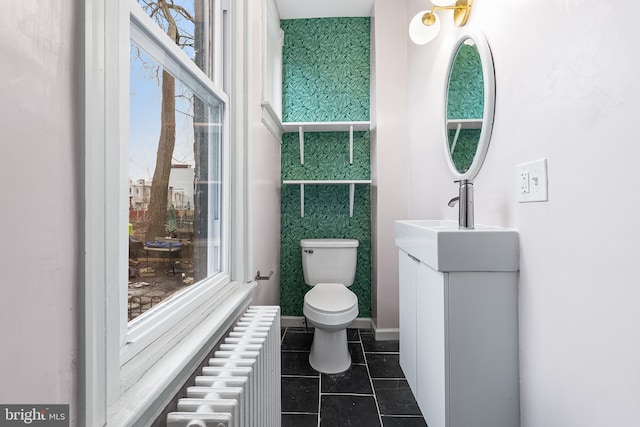 bathroom featuring vanity, radiator heating unit, tile patterned floors, and toilet