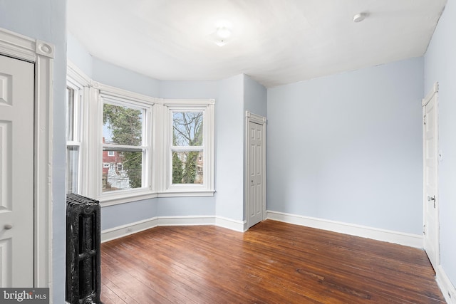 interior space featuring dark hardwood / wood-style floors and radiator