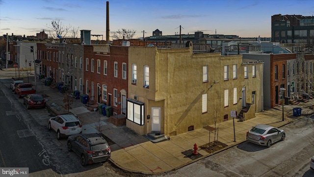 view of outdoor building at dusk