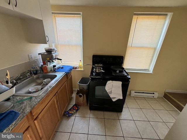 interior space featuring sink, tile patterned floors, and baseboard heating