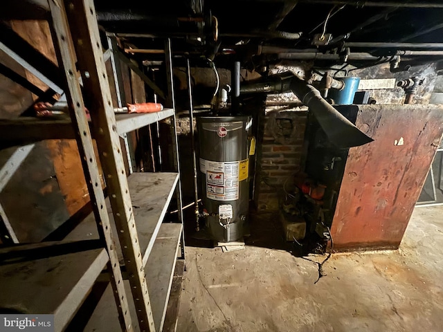 utility room featuring gas water heater