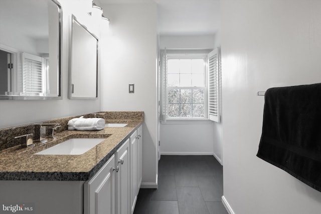 bathroom featuring tile patterned flooring and vanity