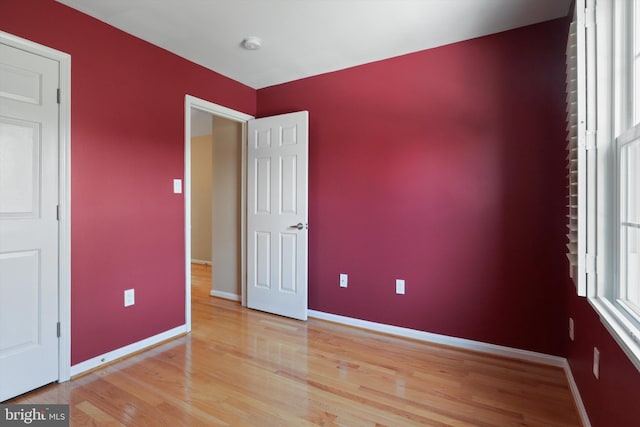 unfurnished room featuring light wood-type flooring