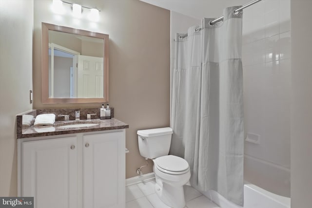 full bathroom with shower / tub combo with curtain, vanity, tile patterned floors, and toilet