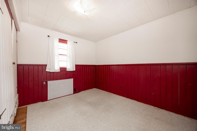 spare room with wooden walls