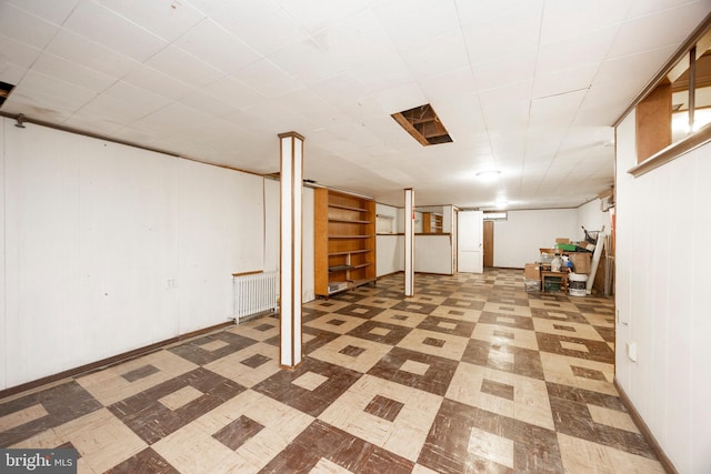 basement featuring radiator heating unit