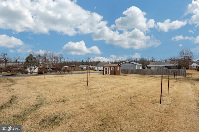 view of yard with a storage shed