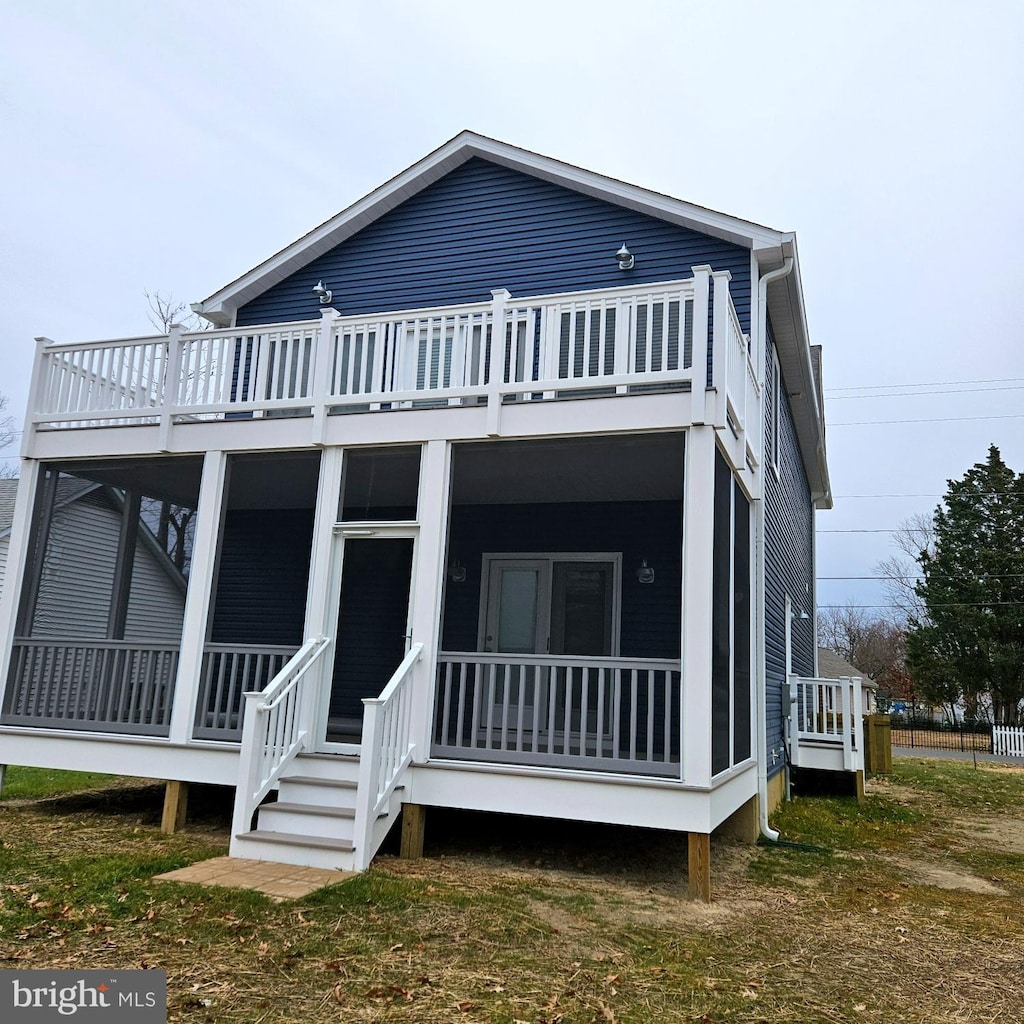 view of front facade with a sunroom