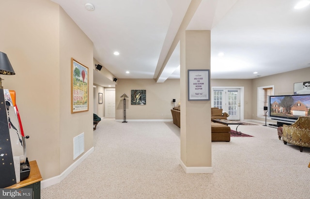 carpeted living room with french doors