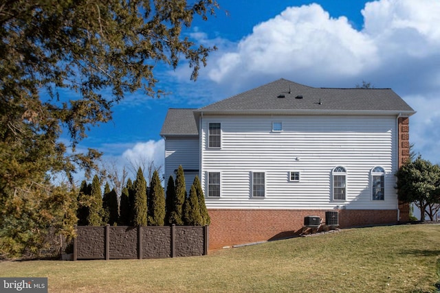 view of property exterior with a yard