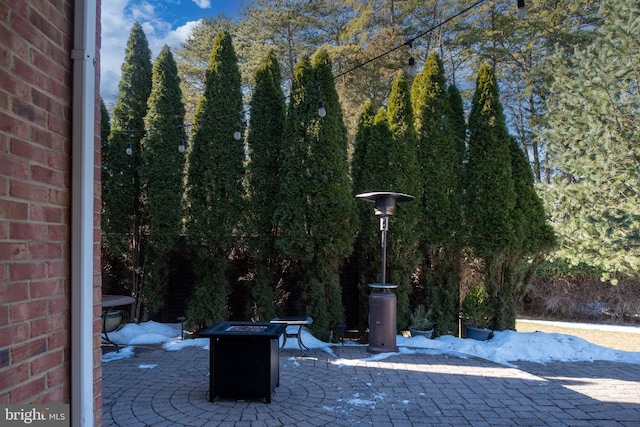 view of patio / terrace with a fire pit