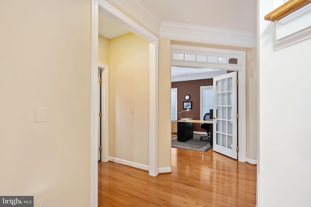 hall featuring ornamental molding and hardwood / wood-style floors