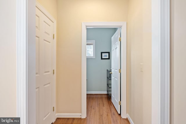 hallway with light wood-type flooring