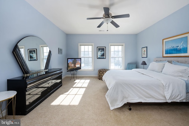 bedroom with light carpet and ceiling fan