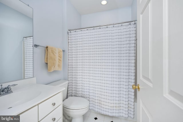 bathroom featuring vanity, a shower with curtain, and toilet