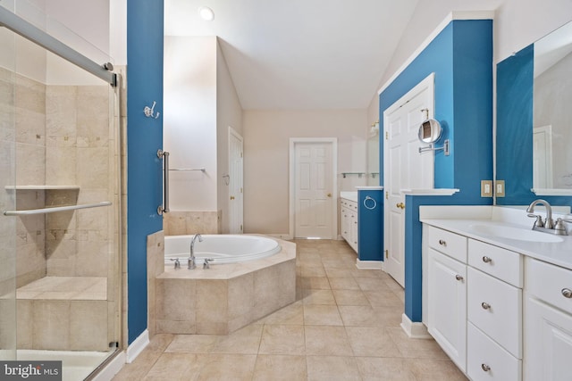 bathroom with tile patterned floors, vanity, and plus walk in shower