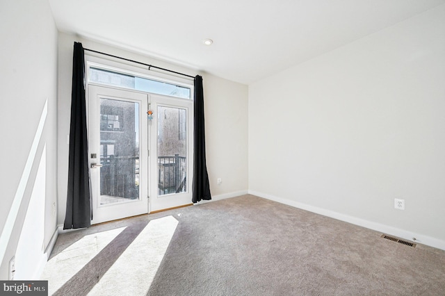 empty room featuring light colored carpet