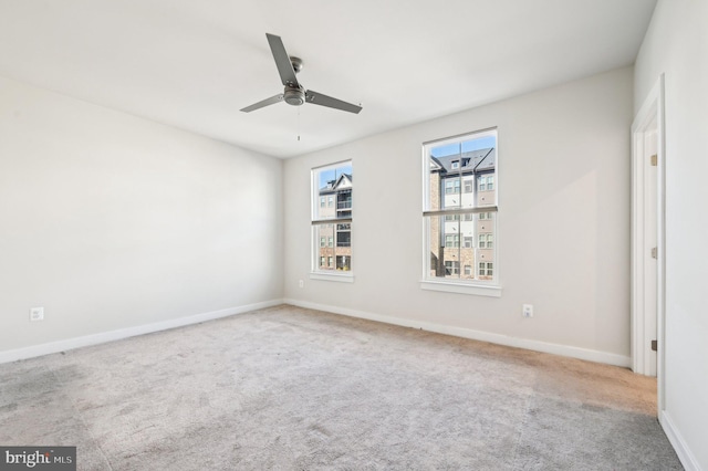 spare room with ceiling fan and carpet floors