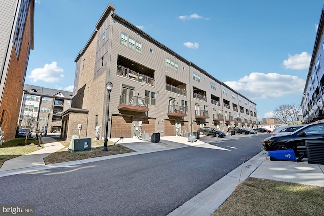 view of building exterior with central AC