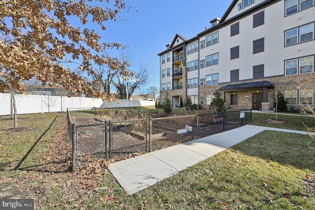 view of home's community with a lawn