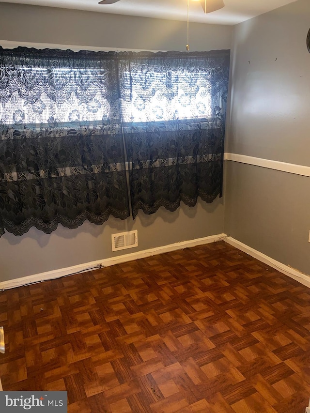 spare room with parquet floors