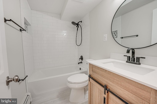 full bathroom featuring vanity, tiled shower / bath combo, toilet, and baseboard heating