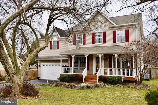 view of front of property featuring a garage, a porch, central air condition unit, and a front lawn