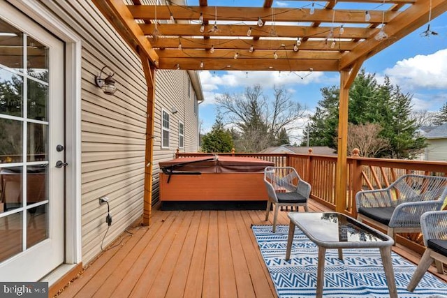 deck with a pergola and a hot tub