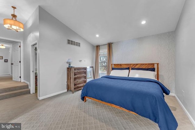 bedroom featuring light carpet and lofted ceiling