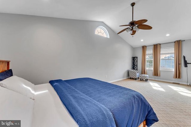 bedroom with lofted ceiling, light colored carpet, and ceiling fan