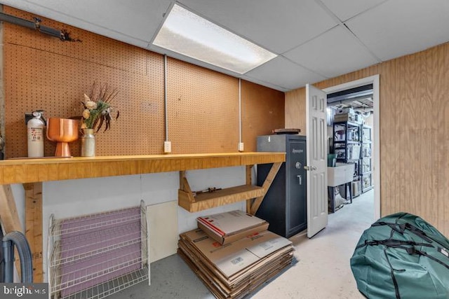 basement featuring a paneled ceiling