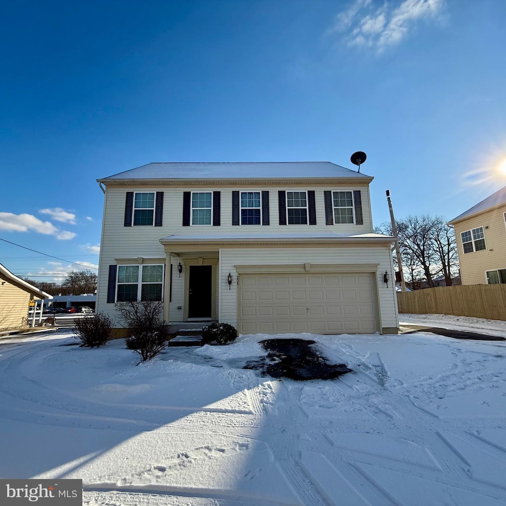 view of front of property with a garage