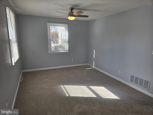 spare room featuring ceiling fan and carpet flooring