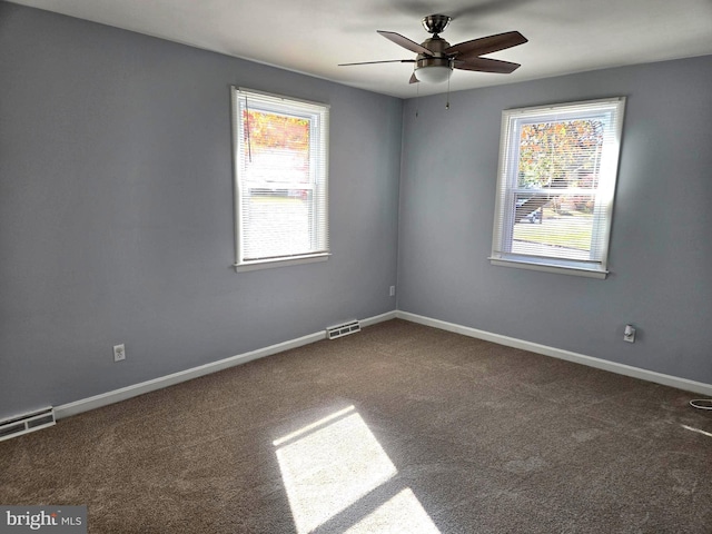 carpeted empty room with ceiling fan