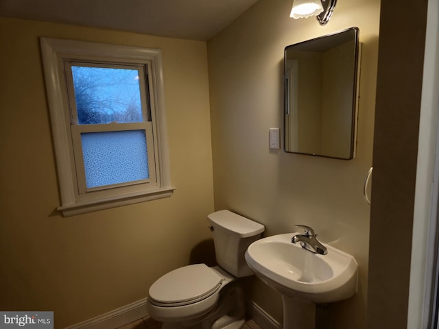 bathroom with sink and toilet