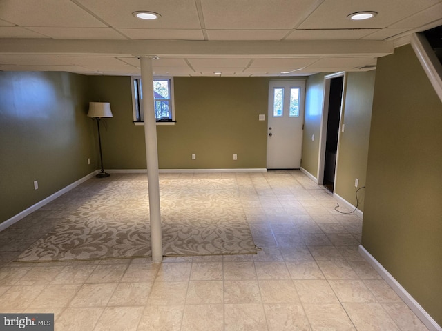 basement featuring a drop ceiling