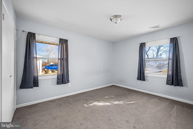 empty room featuring carpet flooring