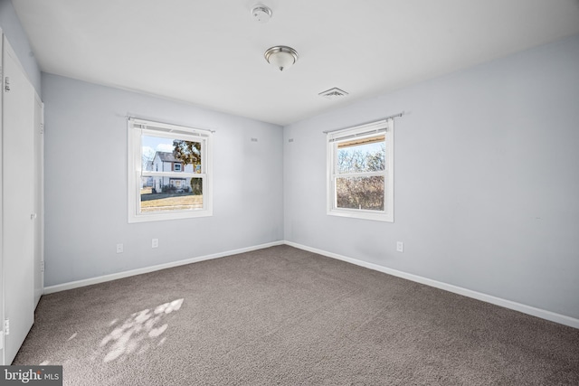 empty room with carpet flooring