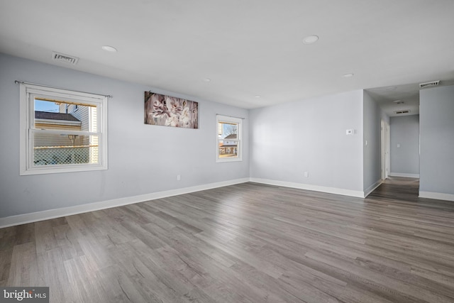 empty room with hardwood / wood-style flooring