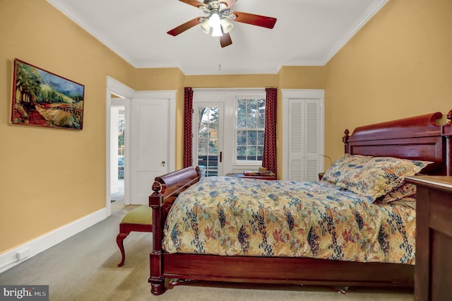 carpeted bedroom with ornamental molding and ceiling fan