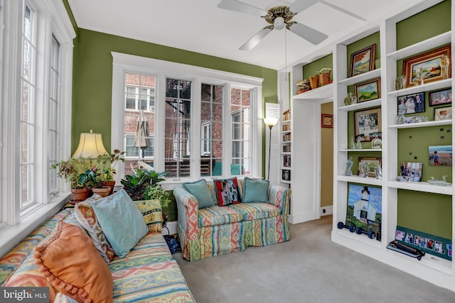 sunroom with ceiling fan