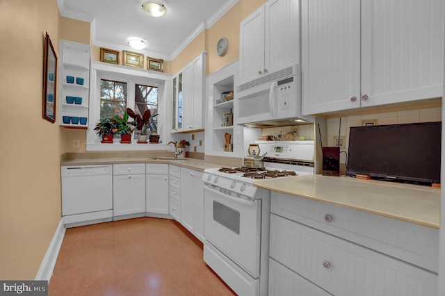 kitchen featuring white cabinetry, sink, crown molding, and white appliances