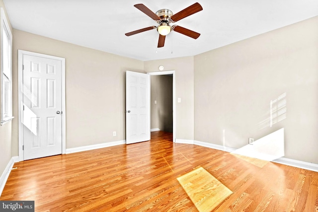 unfurnished room with ceiling fan and light hardwood / wood-style flooring