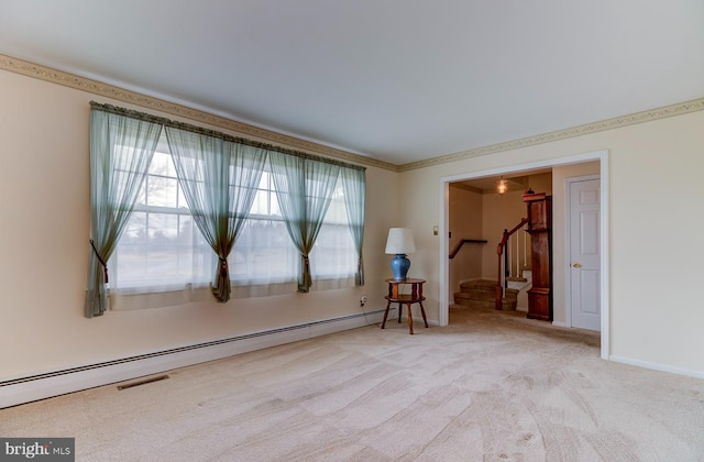 carpeted empty room featuring a baseboard radiator