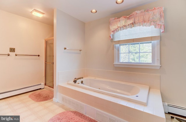 bathroom with a baseboard radiator and plus walk in shower