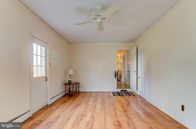 unfurnished room featuring ceiling fan, crown molding, light hardwood / wood-style flooring, and a baseboard radiator