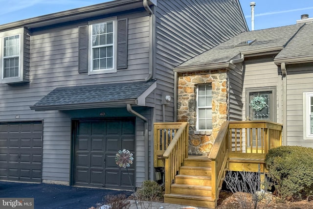 view of exterior entry featuring a garage