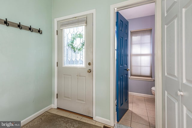 doorway with light tile patterned floors